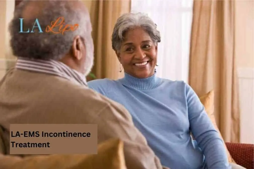 Couple sat smiling at each other - LA-EMS treatment Milton Keynes