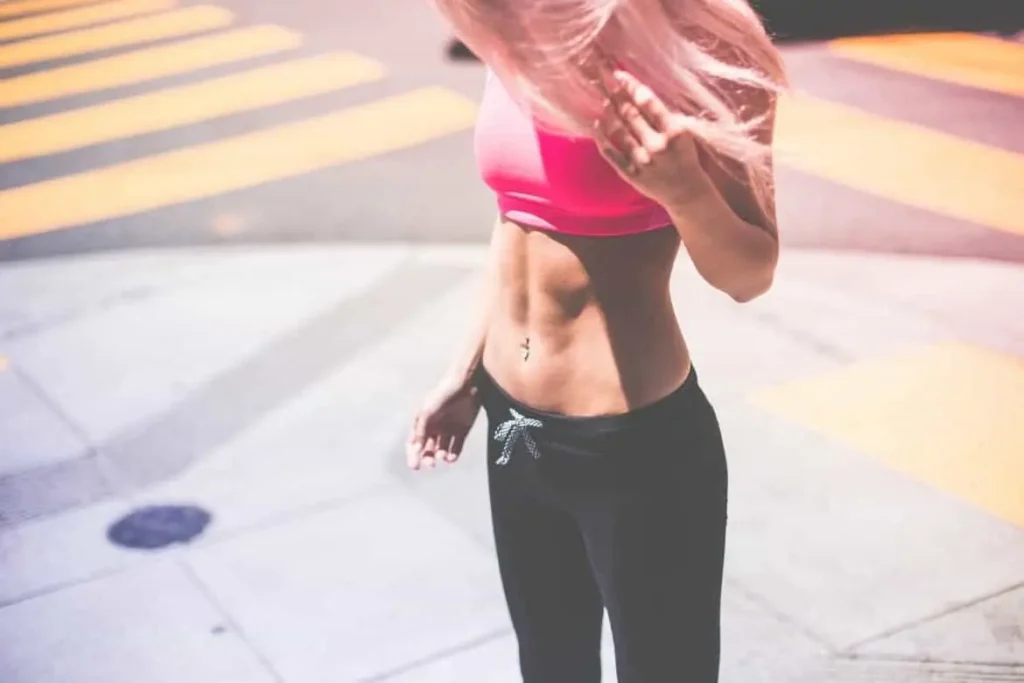 Woman with toned stomach after LA-EMS Body Sculpting Treatment Milton Keynes